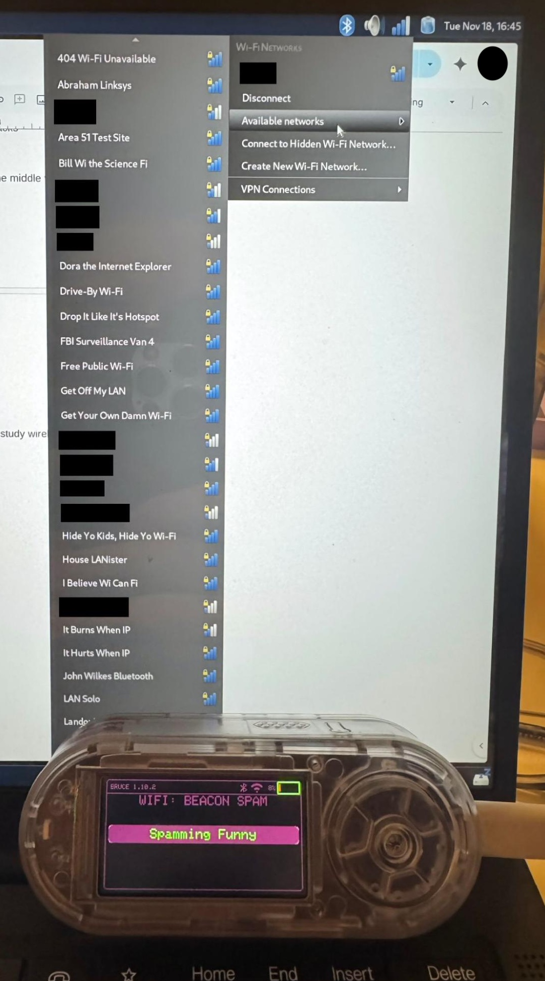 The LILYGO device running WiFi beacon spam, with a laptop showing a list of fake joke SSIDs